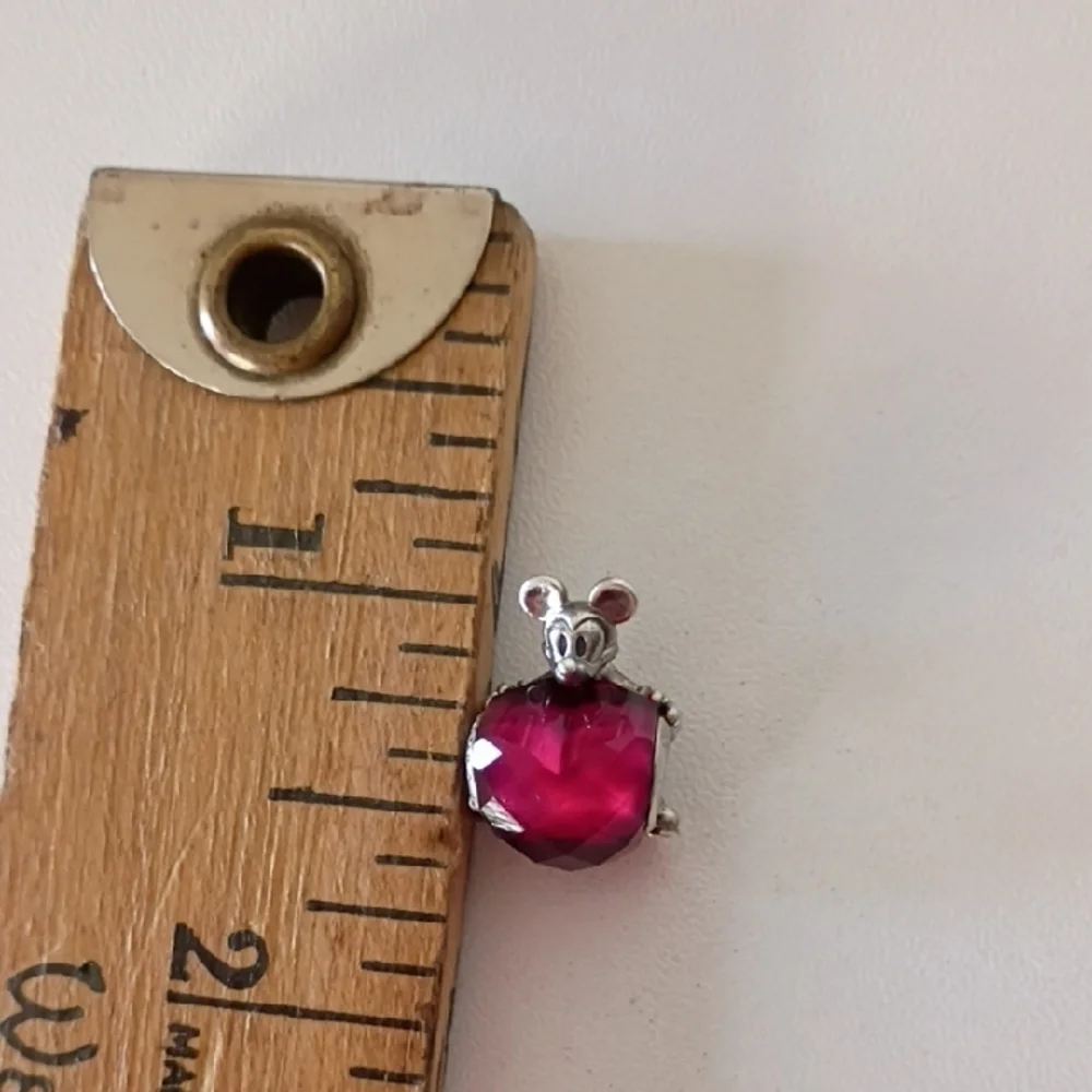 Pandora Disney Mickey Mouse Heart charm featuring a fuchsia crystal.